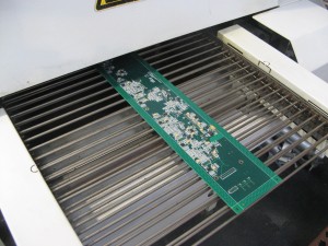 Surface Mount board coming out of the re-flow oven